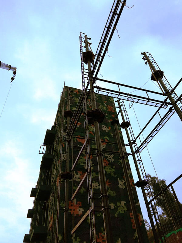 high ropes course, rock climbing wall, military training equipment