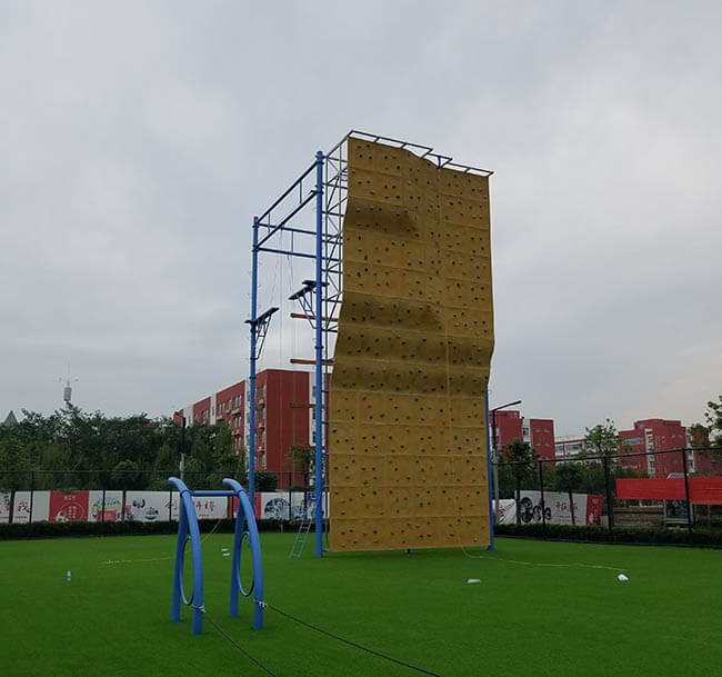 adventure playground, rock climbing wall, high ropes challenge, team building equipment