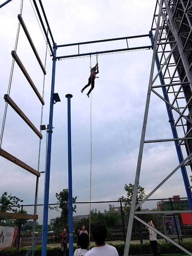 adventure playground, rock climbing wall, high ropes challenge, team building equipment