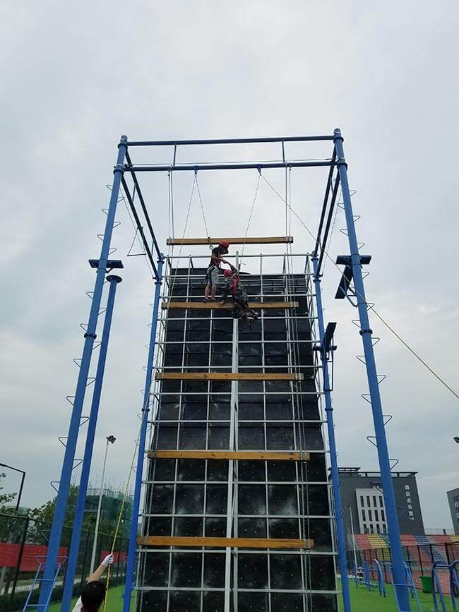 adventure playground, rock climbing wall, high ropes challenge, team building equipment